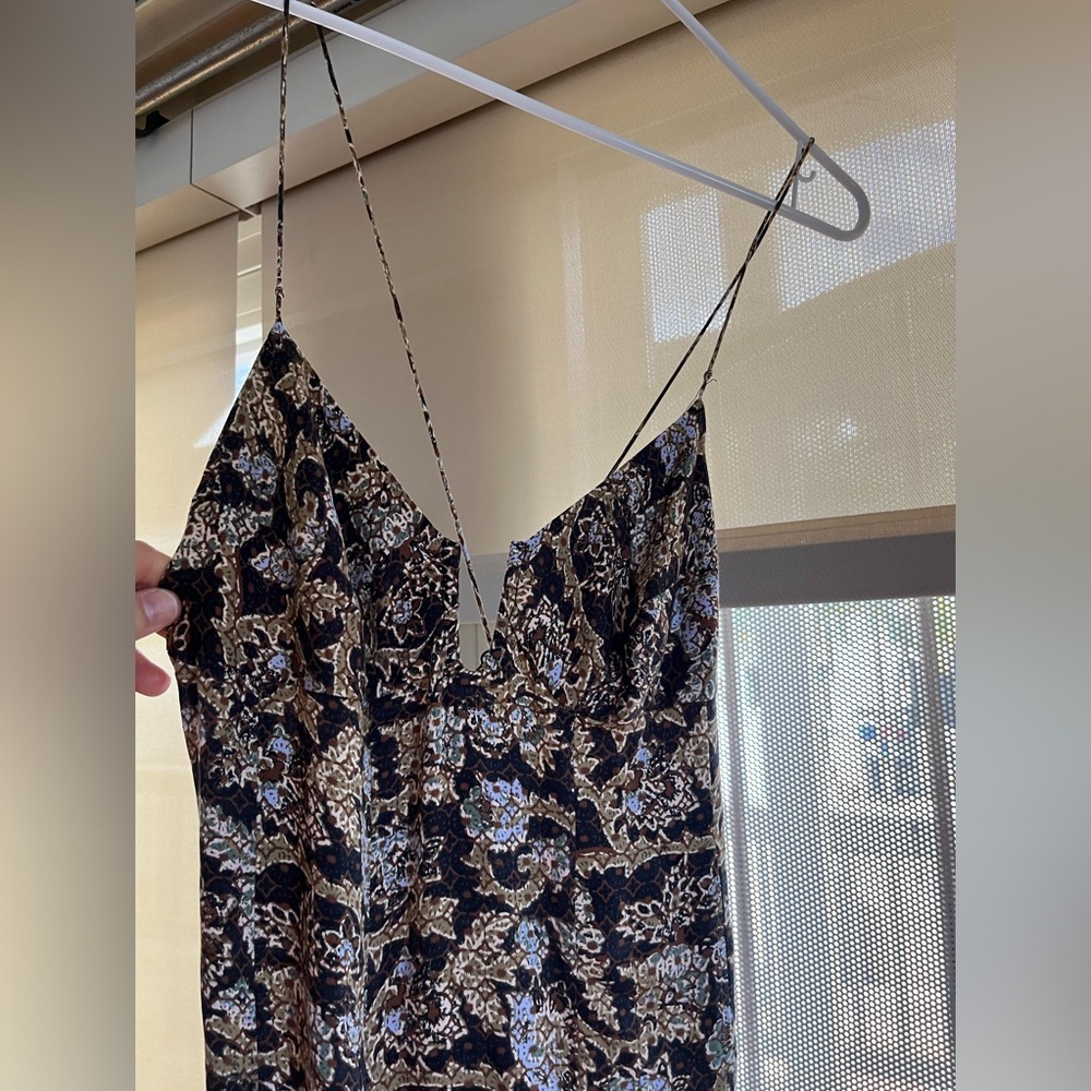 Free people maxi. backless, two strings join at the back with tiny charms.